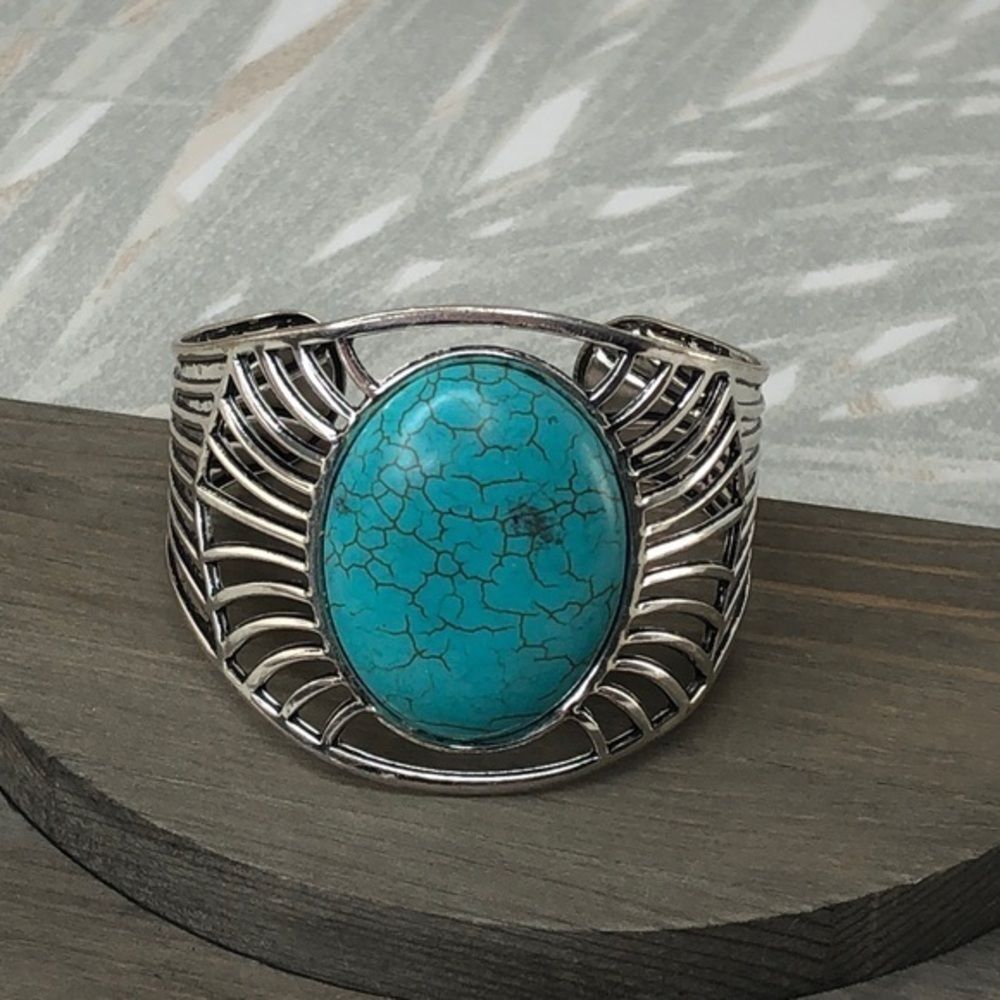 Bangle bracelet in colors of silver and turquoise